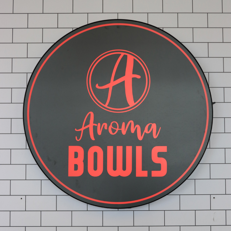 Photo of the sign for Aroma in the Campus Center.